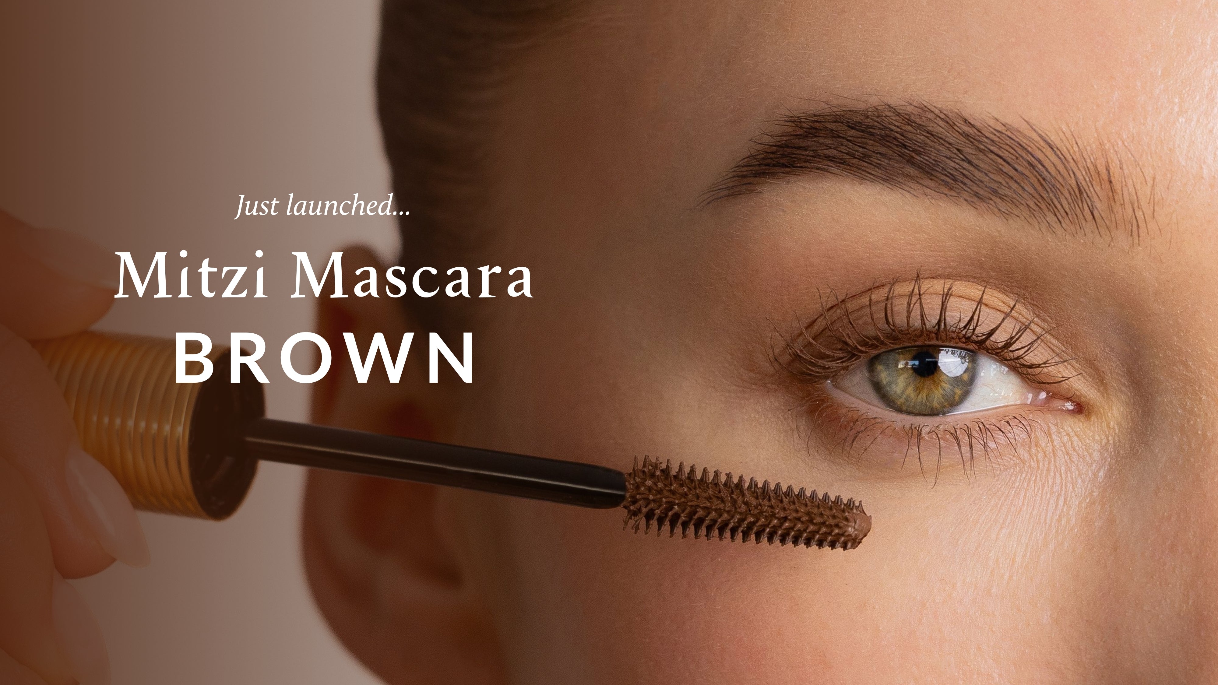 Close-up of an eye with Mitzi Mascara Brown mascara being applied, vegan natural-looking makeup