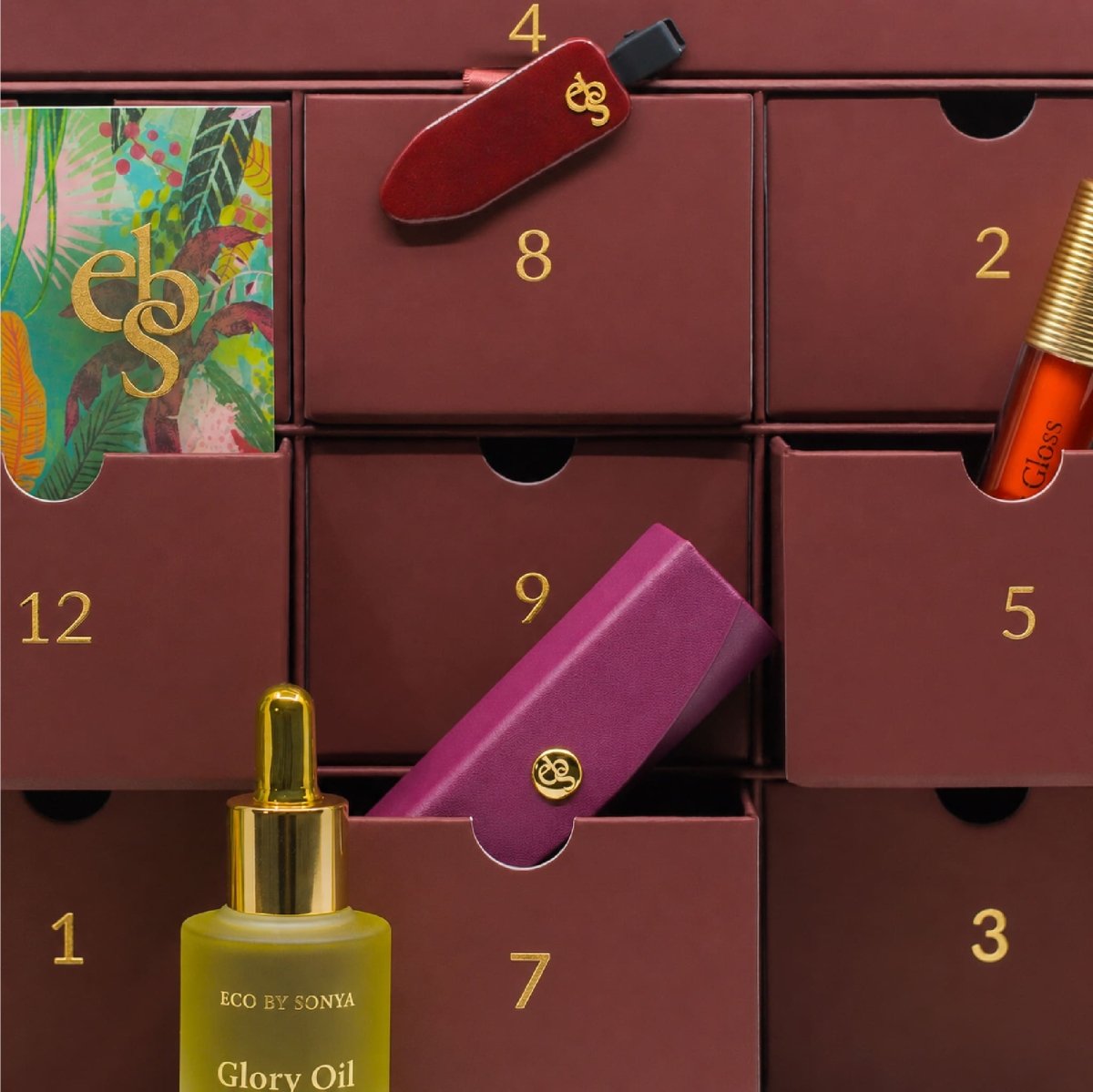 Close-up of Eco By Sonya The Paradise Collection Christmas Advent Calendar with beauty products displayed in its drawers.