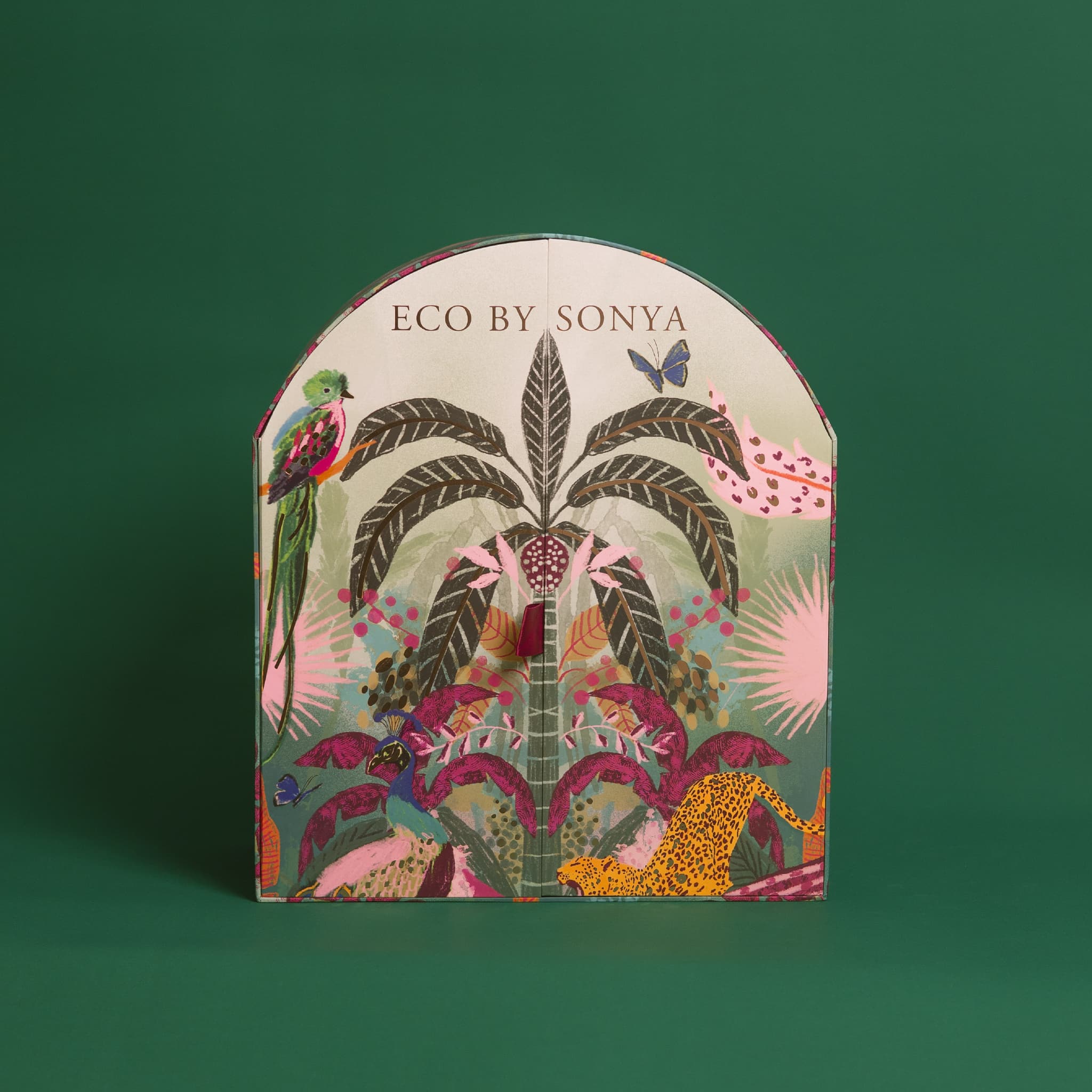 Eco By Sonya The Paradise Collection Christmas Advent Calendar box featuring a colourful tropical jungle pattern on a dark green background.