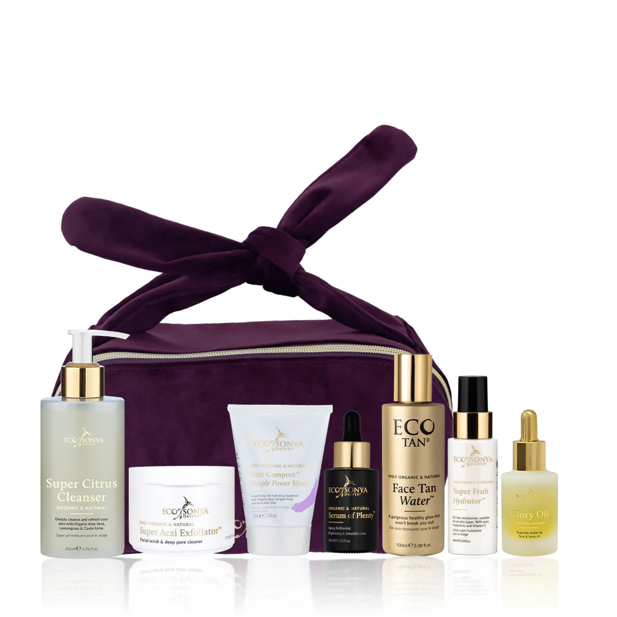 Set of organic skincare products with a purple bag on a white background