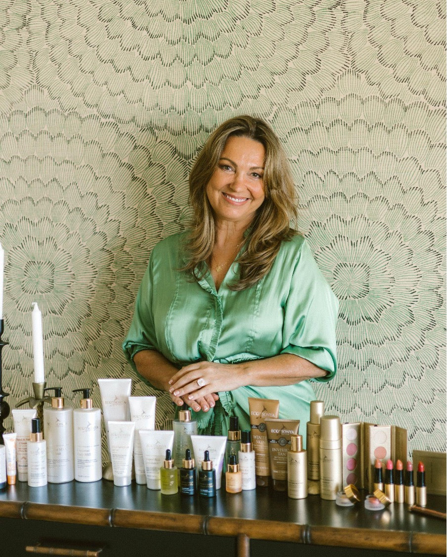 Sonya's smiling next to all her lovely products